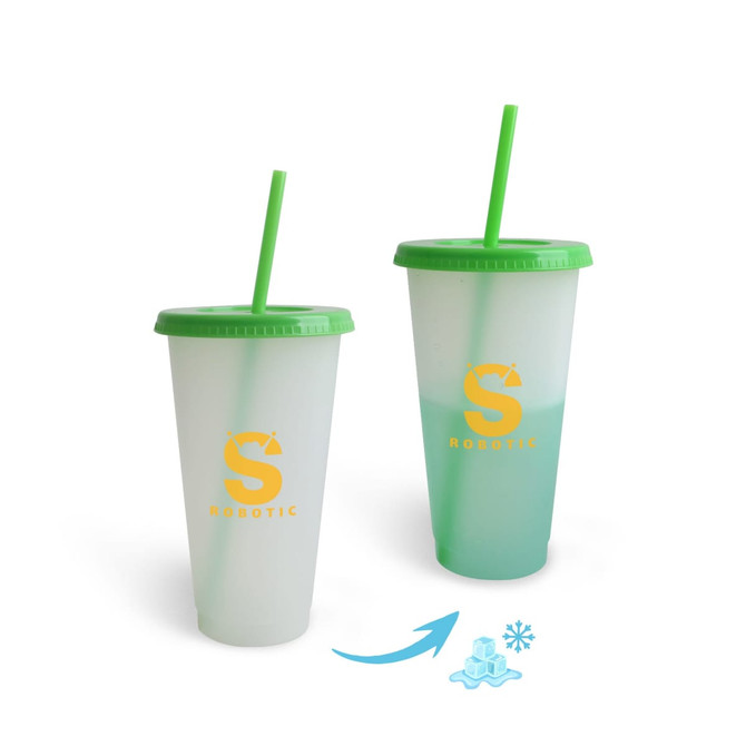 A drink tumbler with a frosted finish, featuring a green lid and straw, changing colour when cold. Includes a logo.