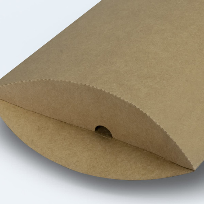 A large, brown pillow box with a rounded edge and a hole at the top for easy opening.