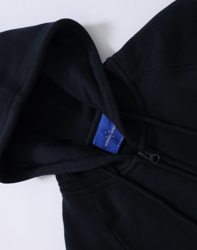 A ladies' full-zip fleecy hoodie in black, featuring a hood and a logo on the interior label.
