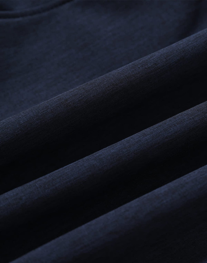 A navy blue softshell fabric displaying smooth, folded sections, featuring a logo. Suitable for a full zip hoodie.