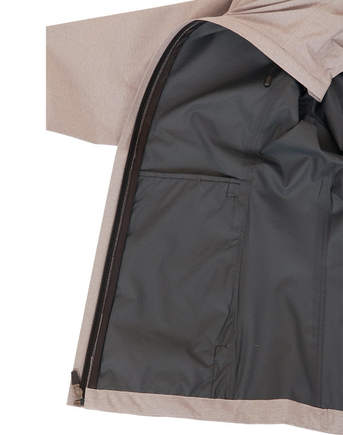 A performance jacket featuring a beige exterior and a dark interior lining with zippered pockets. It has a logo.