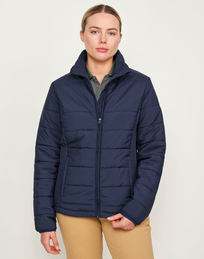 A navy insulated puffer jacket featuring a 3D cut design, with a zip closure and a collar, worn by a model.