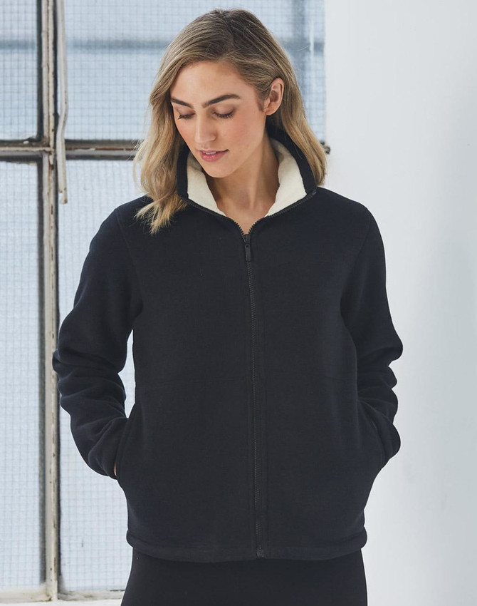 A ladies polar fleece jacket in black with a white fleece-lined collar, featuring a zip front and side pockets.