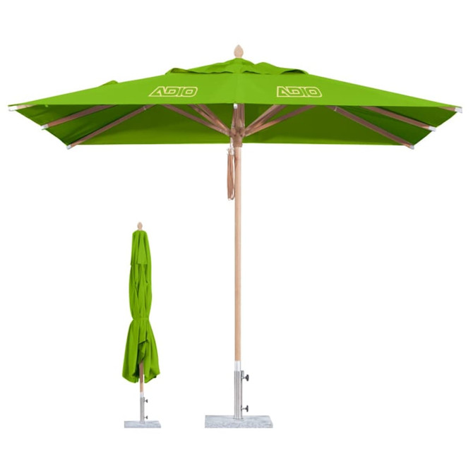 A green wind-resistant square outdoor umbrella with a wooden pole and a base, accompanied by a folded umbrella.