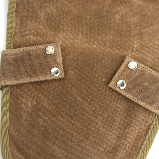 A brown garden tool waist pouch with silver snaps, featuring a sturdy fabric and reinforced edges.