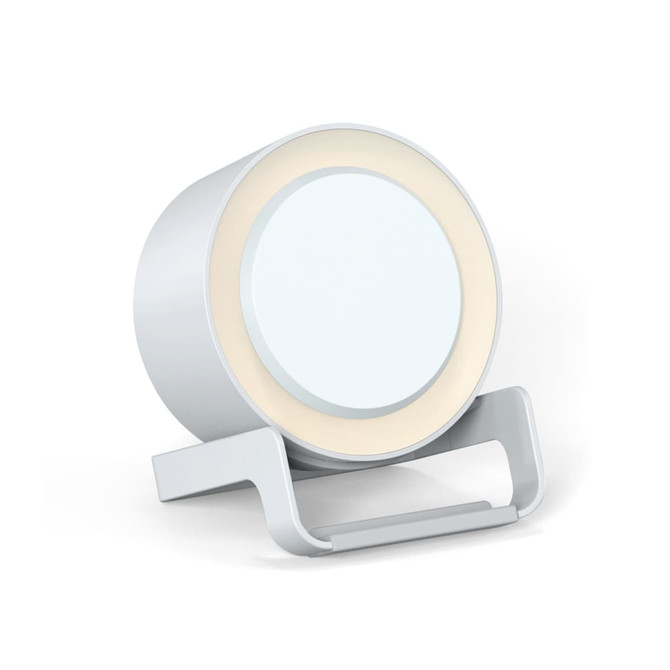 A circular white night light speaker with a wireless charging base, featuring a sleek, modern design.
