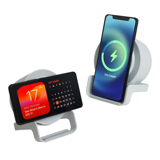 A white night light speaker with a wireless charger, displaying a calendar on one side and a charging phone on the other.