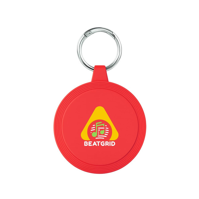 A red circular keychain with a metal ring and a logo on its surface.