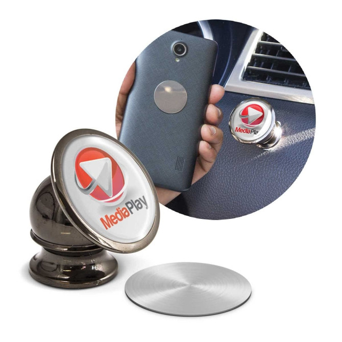 A metallic magnetic phone holder with a shiny base and a circular top, designed for car use, alongside a smartphone.