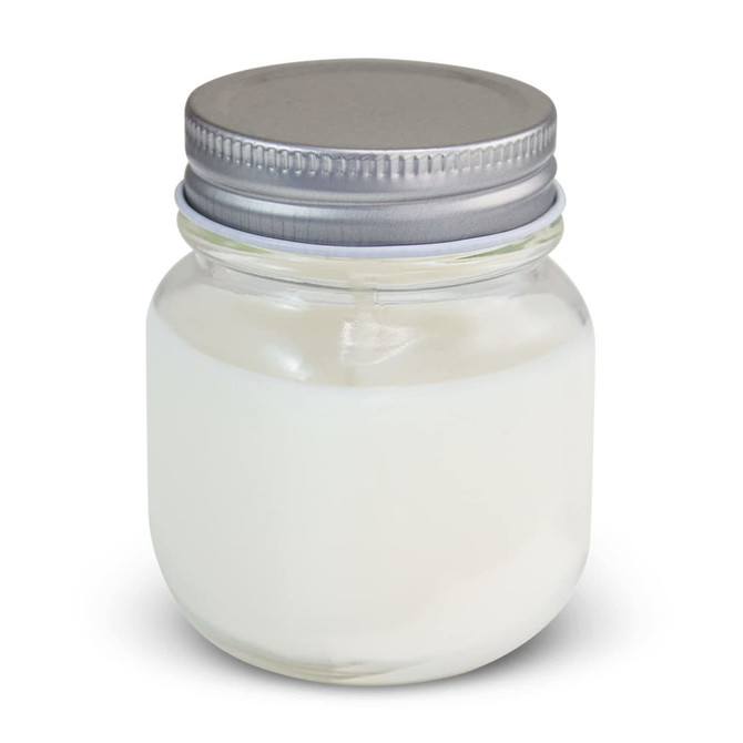 A white scented candle in a glass jar with a silver metal lid. The jar has a smooth finish and a simple design.