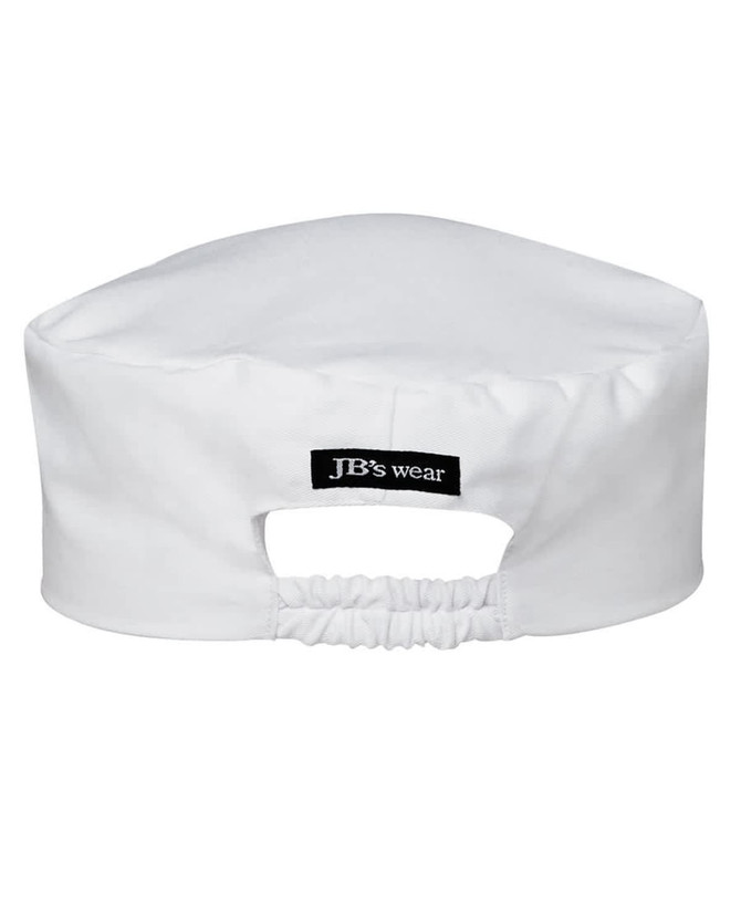 A white chef's cap featuring a logo and an elasticised back for a secure fit.