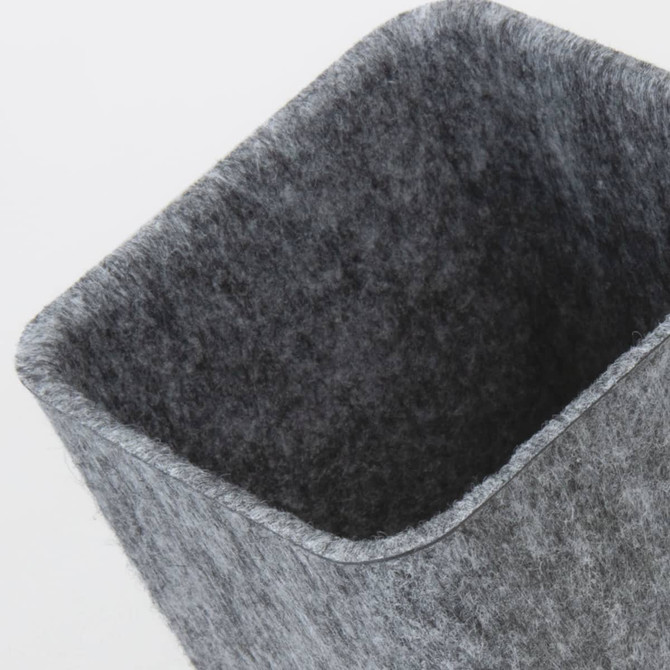 A grey felt desk caddy with a rectangular shape, suitable for holding various stationery items.