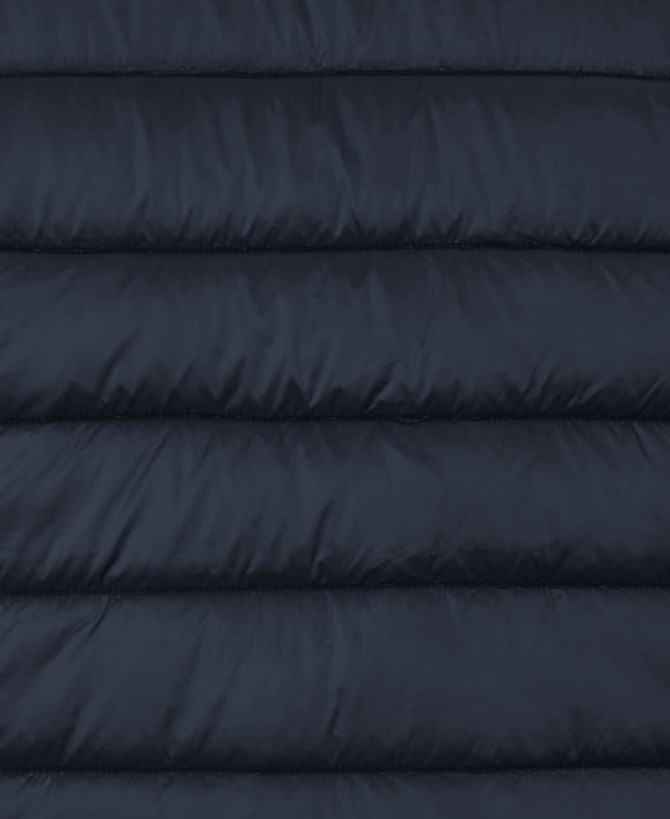 A dark navy puffer vest featuring quilted sections and a logo. The fabric has a smooth finish.