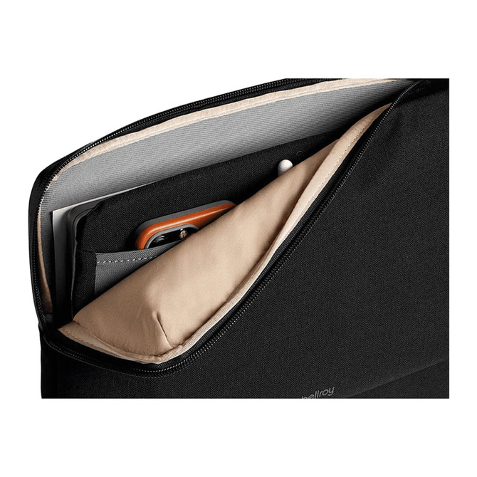 A black laptop caddy with tan lining, featuring compartments for a laptop, documents, and accessories.