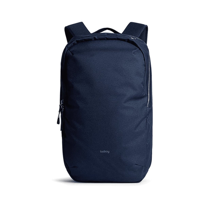 A navy backpack with a sleek design, featuring shoulder straps and a zippered compartment. It has a logo on the front.