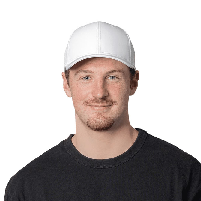 A white cap with a structured design, featuring a logo at the front, worn by a smiling man in a black t-shirt.