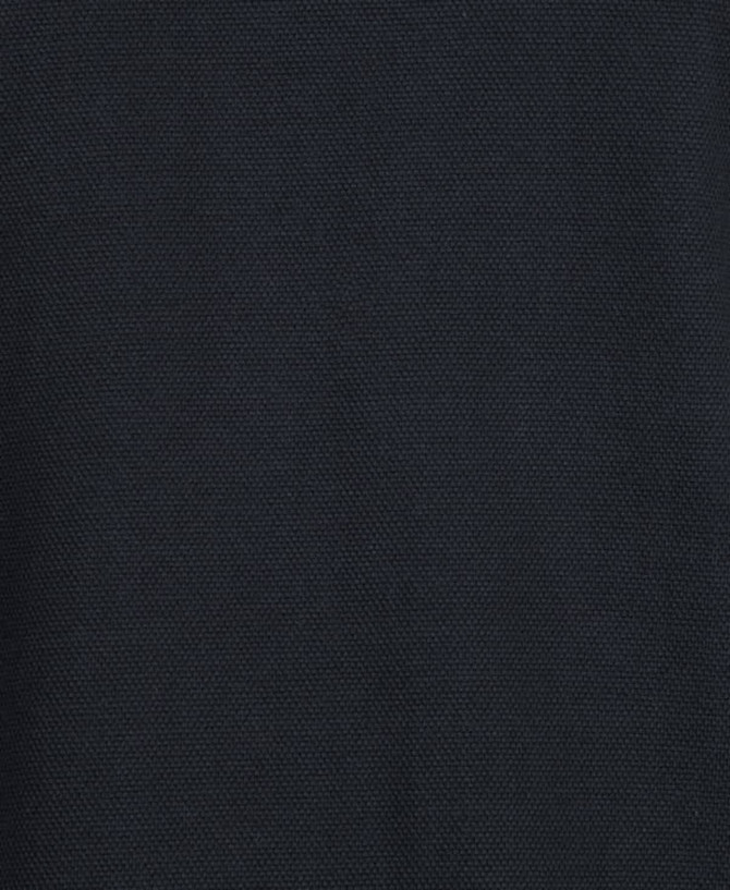 A dark black polo shirt featuring a textured fabric and a logo. Suitable for casual or sporty settings.