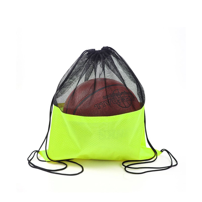 A bright yellow drawstring mesh backpack holding a basketball, with black mesh detailing and drawstrings.
