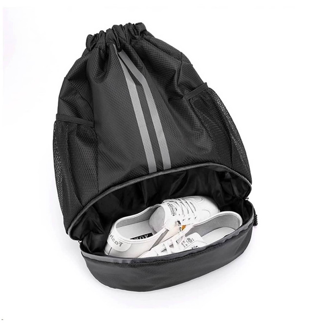 A black drawstring backpack with a compartment for shoes, featuring mesh sides and grey stripes.