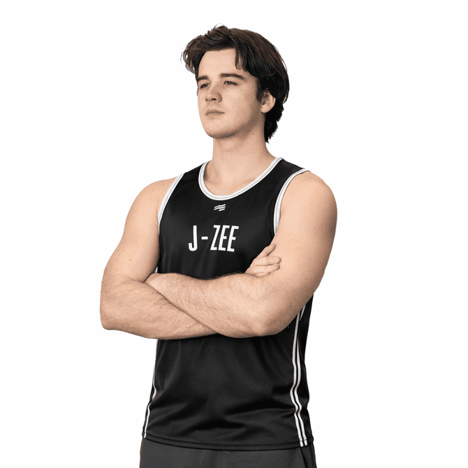 A black singlet featuring white detailing and a logo, modelled by a person with arms crossed.