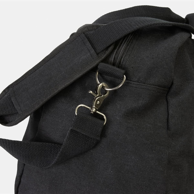 A black canvas duffle bag featuring a zipper and adjustable shoulder strap with a metal clasp.