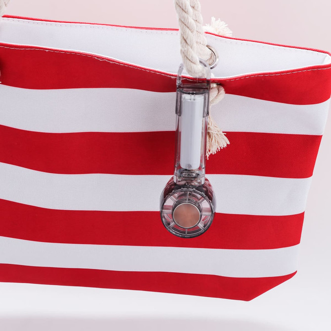 A red and white striped tote bag with a transparent cooling fan attached. The bag has rope handles.