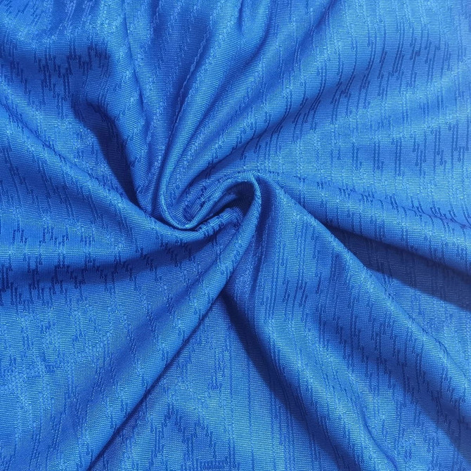 A vibrant blue fabric with a textured pattern, suitable for breathable and lightweight clothing.