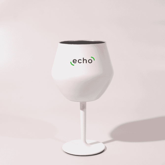 A white Shiraz detachable wine glass with a black interior and a stand, featuring a logo.