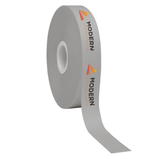 A roll of grey cotton ribbon featuring printed text and a logo design.