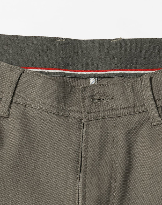 A pair of ladies' flexi chino pants in grey, featuring a waistband with detailing and a logo.