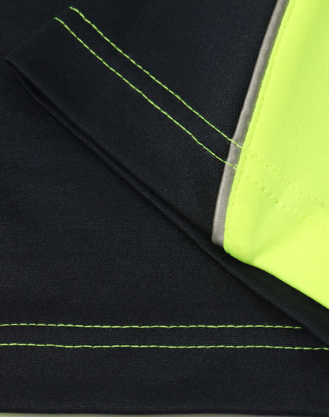 A close-up of a black and hi-vis yellow long-sleeve polo shirt, featuring contrast stitching and neckline.