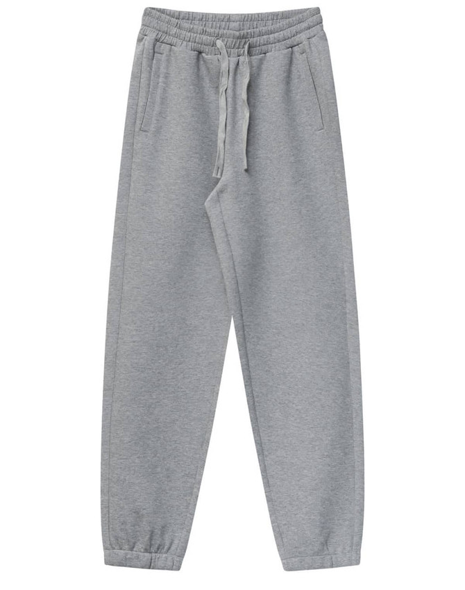 Grey unisex sweatpants with a drawstring waist and pockets, featuring a logo.