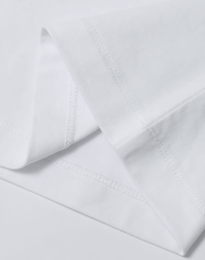 A folded white men's premium cotton t-shirt showcasing neat stitching details and a brand logo.