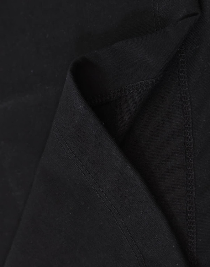 A black premium cotton long-sleeve tee shirt, showcasing the soft fabric and stitching details.
