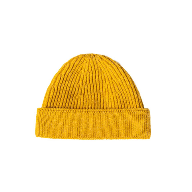 A round beanie in bright yellow, featuring a ribbed texture and a folded cuff at the base.