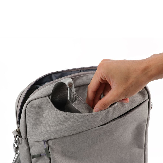 A grey business sling laptop bag with a hand reaching into an outer pocket. It features a sleek design and a logo.