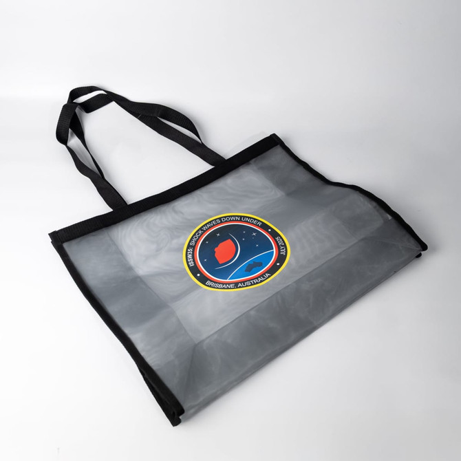 A grey nylon mesh tote bag with black handles and a circular logo in the centre.