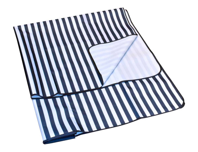 An extra-large navy and white striped picnic rug with a foldable design and black edging.