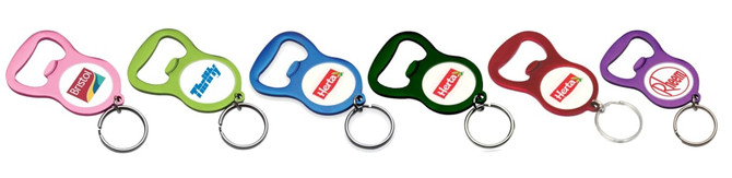 A drink bottle opener keyring in various colours: pink, green, black, red, and purple, featuring a logo on each.