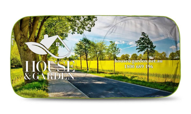 A full-colour sunshade featuring a scenic landscape with trees and a road, displaying a logo and branding.