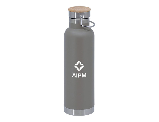 A drink bottle featuring a grey finish, a wooden lid, and a metallic base, with a logo on the front.