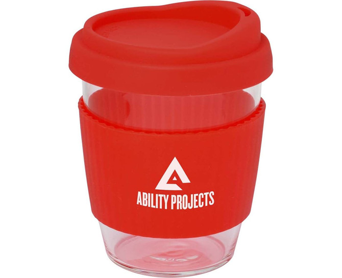 A drink bottle featuring a clear body and a red silicone lid and sleeve, with a logo on the side.