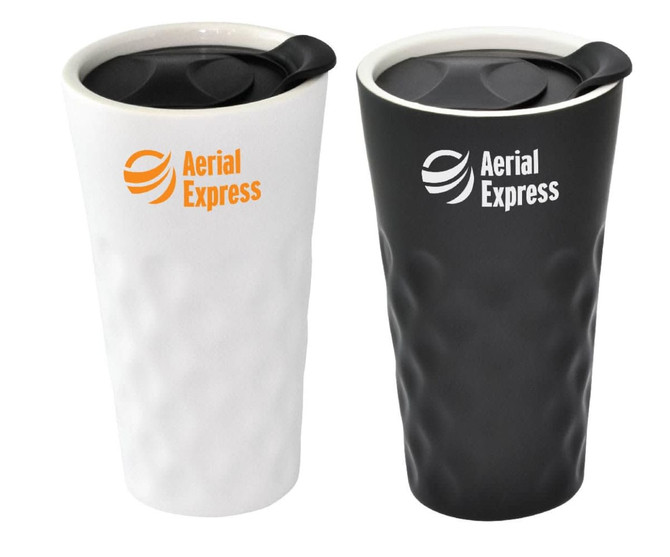 A set of two Supremo Ceramic Mugs, one in white and one in black, both featuring a logo and a black lid.