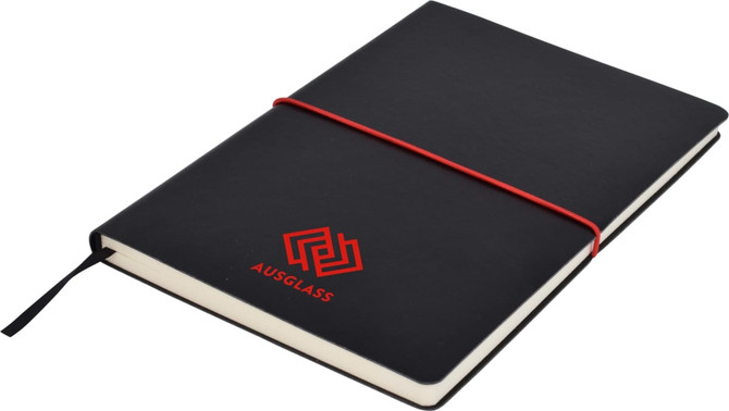 A black A5 notepad with a red elastic band, featuring a logo on the cover.