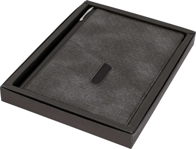 A grey A5 notebook in a sleek black box, featuring a pen loop and a subtle logo.