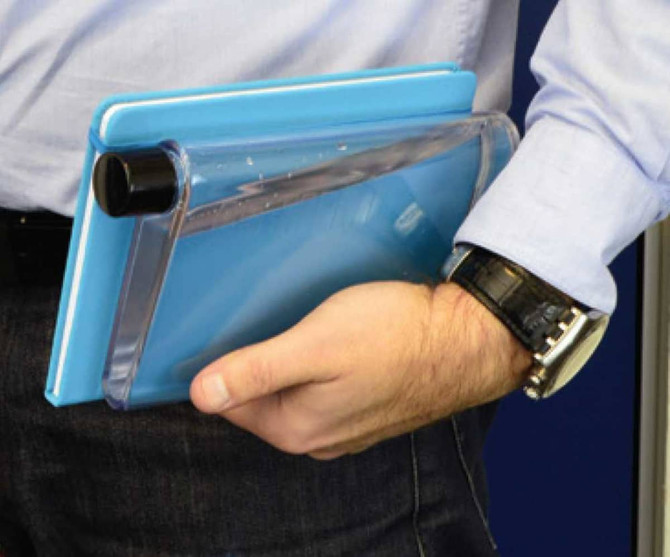 A drink bottle in a sleek, transparent design with a blue back, held alongside a notepad. Features a logo.