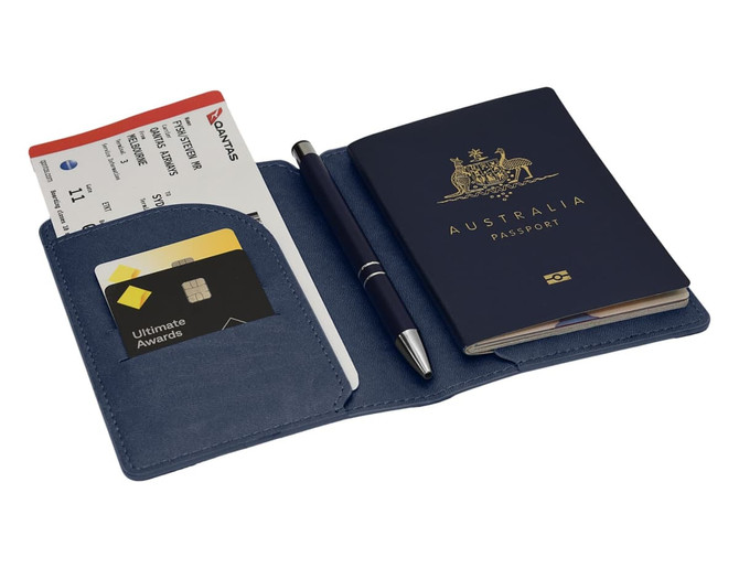 A navy blue passport wallet displaying an Australian passport, tickets, and a pen. It includes a card slot.