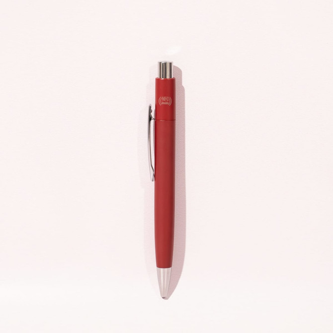 A red metal pen featuring a sleek design and a clip, with a logo on its barrel.