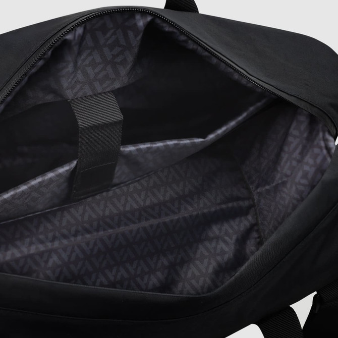 A black duffle bag with a patterned interior and inner pocket, featuring a simple design and a logo.
