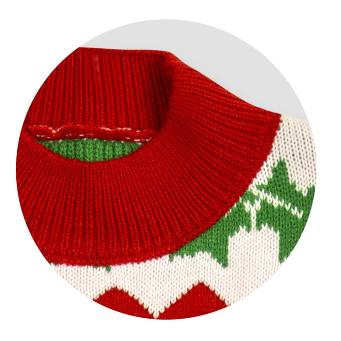 A red and white knitted jumper with a green pattern around the neckline. Features a festive design.